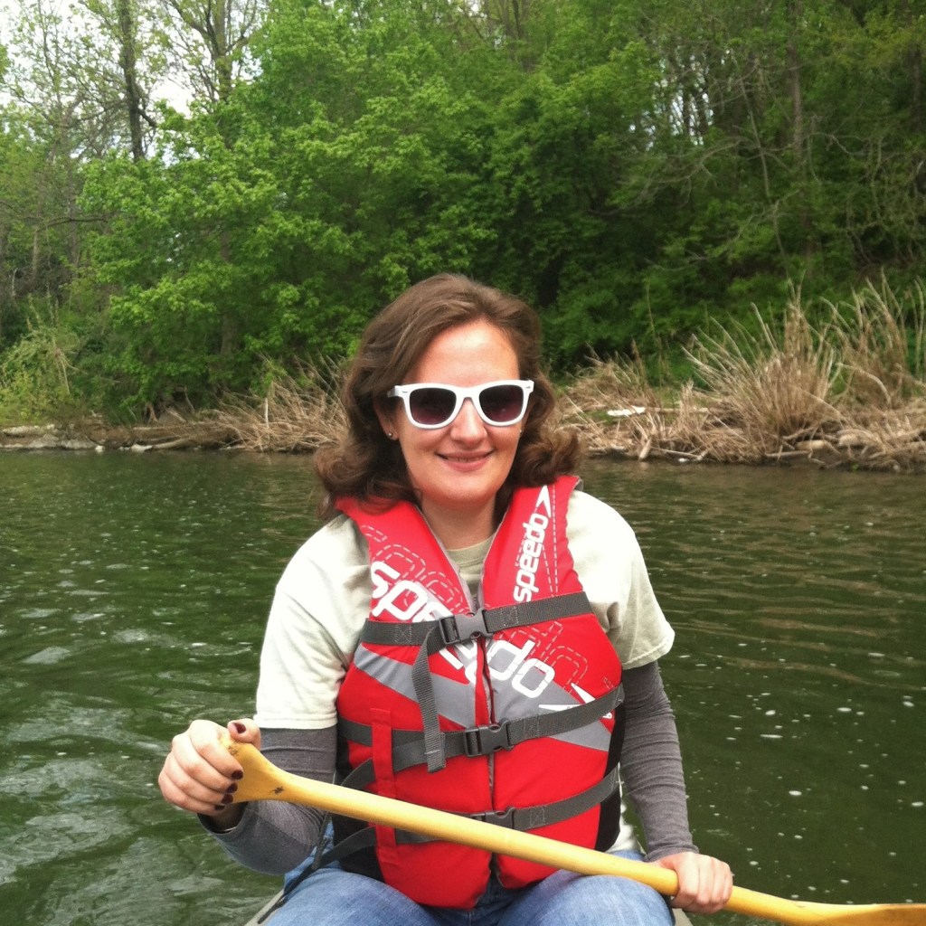 Carolyn canoeing along a river, looking for turtles. Shenandoah River, Virginia, 2013.